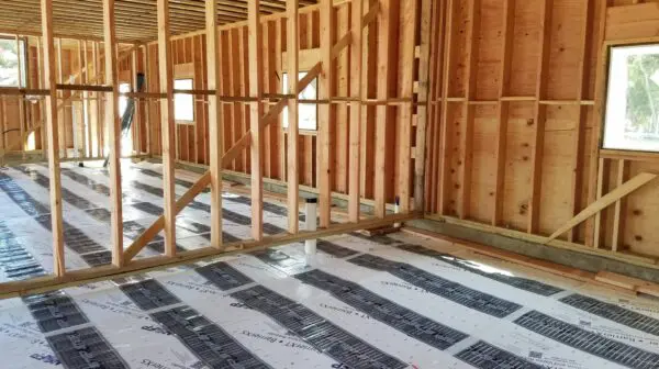 radiant heat mat being installed in a buiding